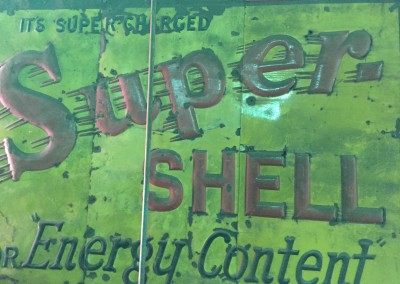 Antique metal sign for super Shell